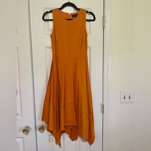 Donna Karen New York asymmetrical hem orange dress.